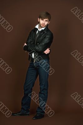 man in leather jacket with crossed hands man in leather jacket with crossed hands