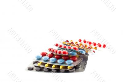 a number of multicolor pill blisters