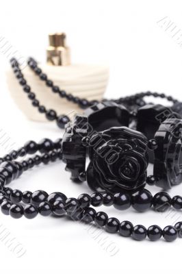 black necklace, bracelet and parfume