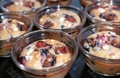 Tasty muffins with berries and nuts