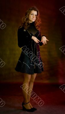 Beauty girl in black on dark background