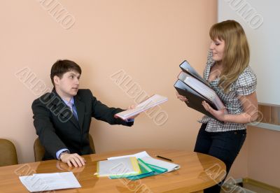 Secretary gives a folders to the chief