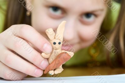 Girl with a plasticine rabbit Girl with a plasticine rabbit