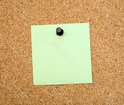 Stickers pinned to a cork board Stickers pinned to a cork board