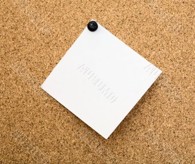 Stickers pinned to a cork board Stickers pinned to a cork board