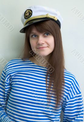 Beautiful girl in a stripped vest and cap