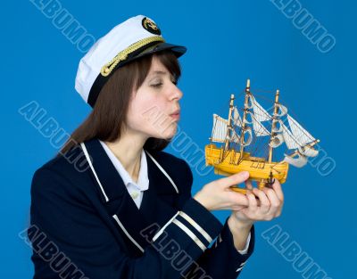 Girl blowing on sails