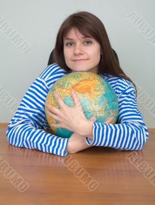 Girl in a stripped vest and globe