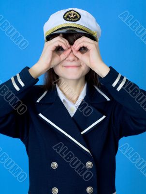 Girl in a sea uniform emits binoculars