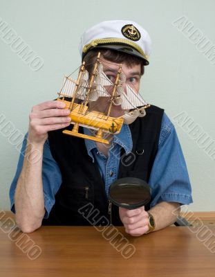 Man in uniform cap with sailer Man in uniform cap with sailer