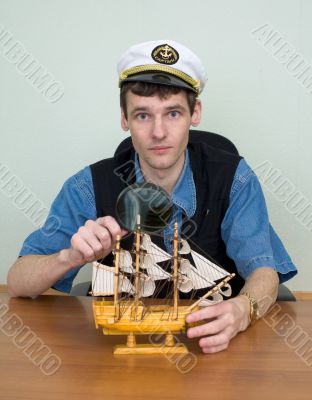 Man in uniform cap with sailer