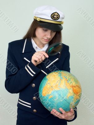 Girl in a sea uniform with the globe