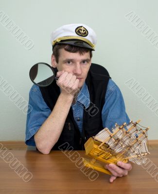 Man in uniform cap with sailer