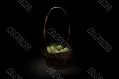Easter basket on canvas background
