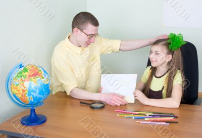 Girl shows new drawing to the brother Girl shows new drawing to the brother