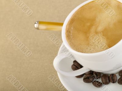 Cup of espresso coffee on hessian