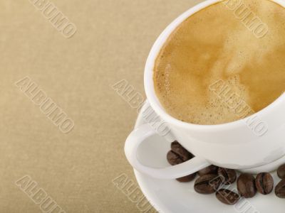 Cup of espresso coffee on hessian