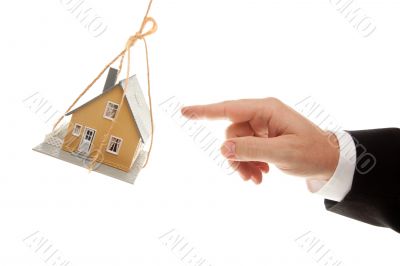 Swinging House and Business Man`s Hand Reaching