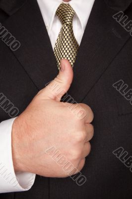 Businessman Gesturing Thumbs Up with Hand