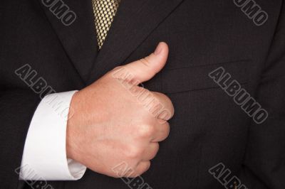 Businessman Gesturing Thumbs Up with Hand