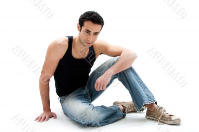 Handsome guy sitting on floor