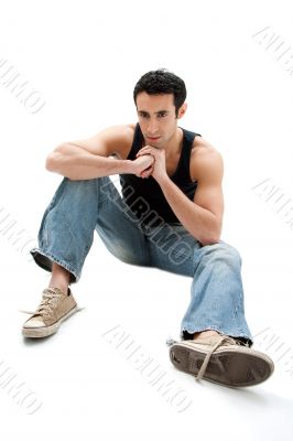 Handsome guy sitting on floor