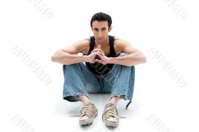 Handsome guy sitting on floor