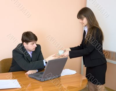 Secretary gives a cup to the chief