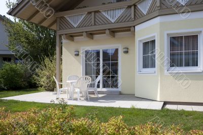 Garden armchair in front of house