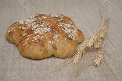 Figured loaf of bread and wheatears Figured loaf of bread and wheatears