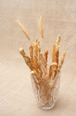 Breadsticks in glass vase