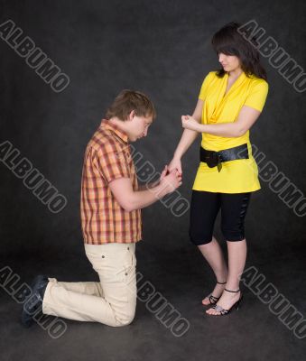 Young woman to shake one`s fist at youth