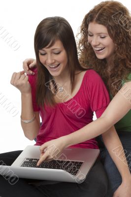 lucky teenagers with laptop