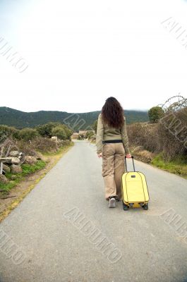 woman walking with suitcase