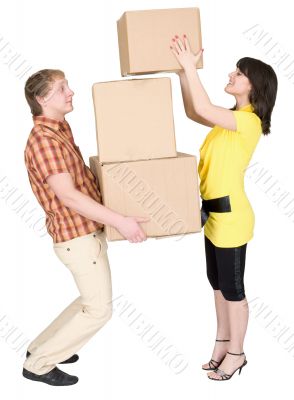 Girl loads the man with cardboard boxes Girl loads the man with cardboard boxes