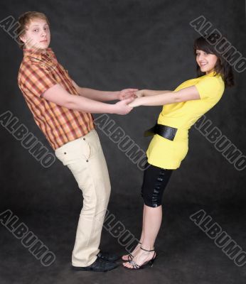 Couple is turned keeping for hands Couple is turned keeping for hands