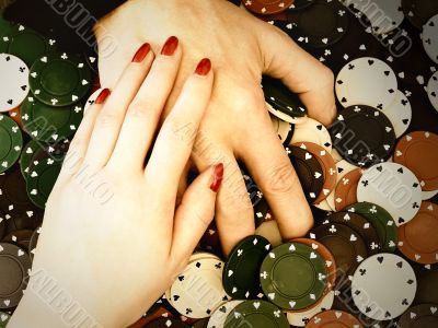 woman and man hands at the stack of chips