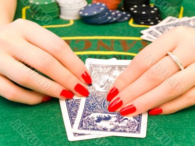 woman hands with playing cards woman hands with playing cards