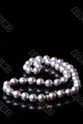 grey pearls on black