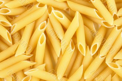 italian pasta - penne rigate background horizontal