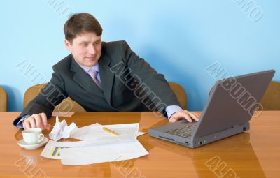 Businessman on a workplace with the laptop