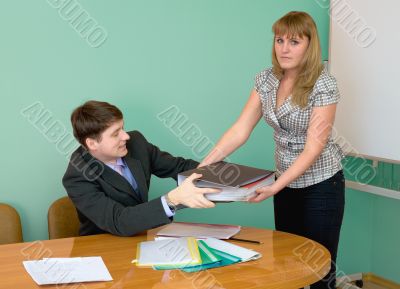 Secretary gives a folders to the chief