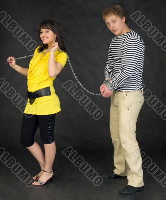 Lady guide shackled young man