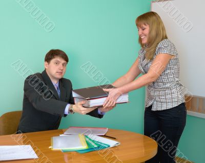 Secretary gives a folders to the chief