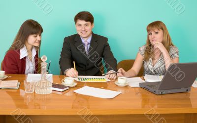 Business team sits at the table