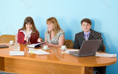 Business team sits at the table