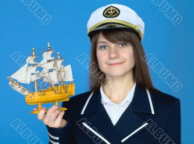 Portrait of the woman in a sea cap with the ship