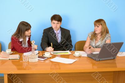 Business team sits at the table