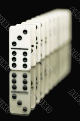 Bones of dominoes on a black background