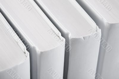 White backs of books close up